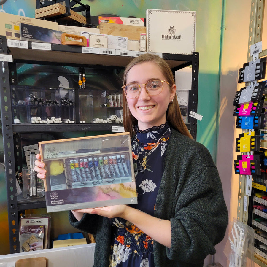 Opus Staff member holding a Winsor & Newton Professional Watercolour Tube Studio Case 20 Piece Set 