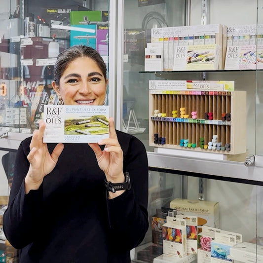 Opus Staff member holding a Winsor & Newton Professional Watercolour Tube Studio Case 20 Piece Set 