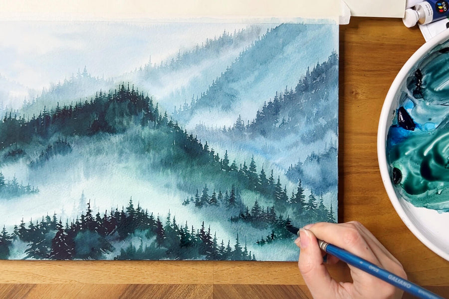 Elena Markelova painting a misty forest.