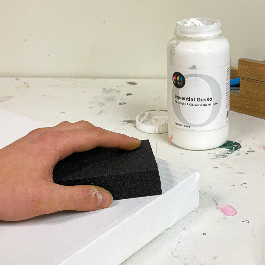 sanding a gesso'd canvas