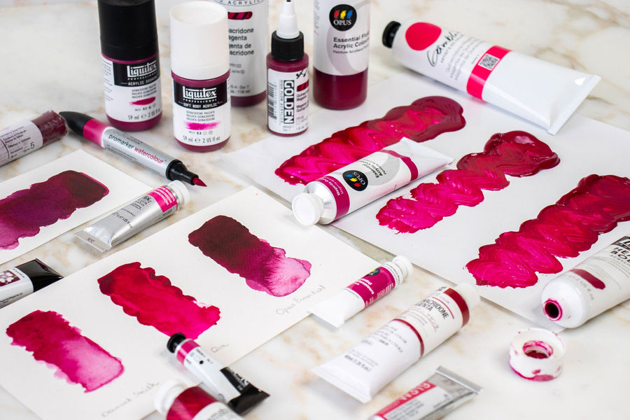 paint swatches and tubes of Quinacridone Magenta from Opus Essential, Gamblin, Liquitex, and Holbein