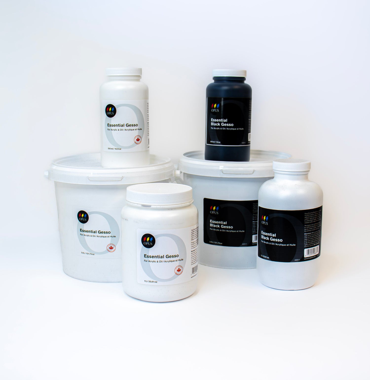 a group of Opus Essential Gesso in white and black - each colour of gesso is shown in 3 sizes of container