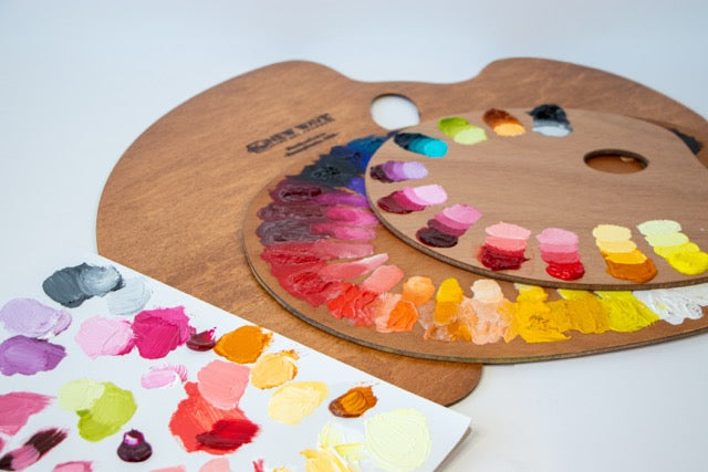 Wooden palette with Opus Essential Oil Colours painted out