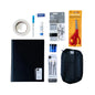 A flat-lay arrangement of stationery and craft supplies on a white background, including a black notebook, black zip pouch, scissors, tape, pens, markers, and other small office accessories.