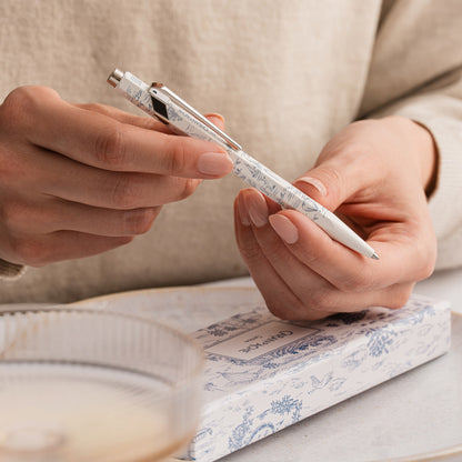 Writing with the Caran d'Ache Toile de Jouy 849 ballpoint pen in white