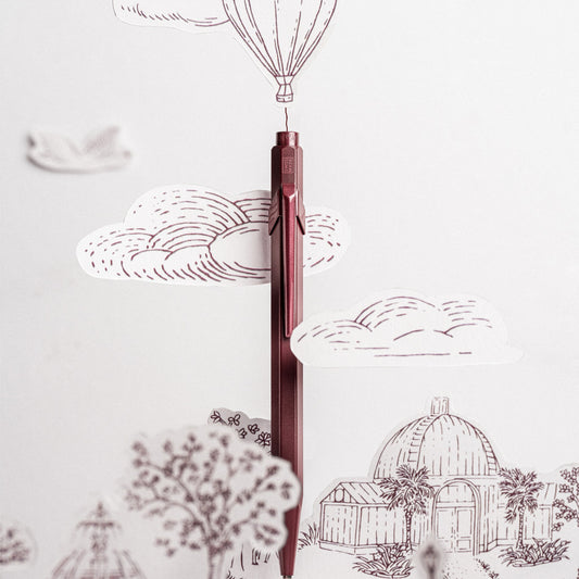 Caran d'Ache Toile de Jouy 849 ballpoint pen in burgundy with Geneva paper cut-outs