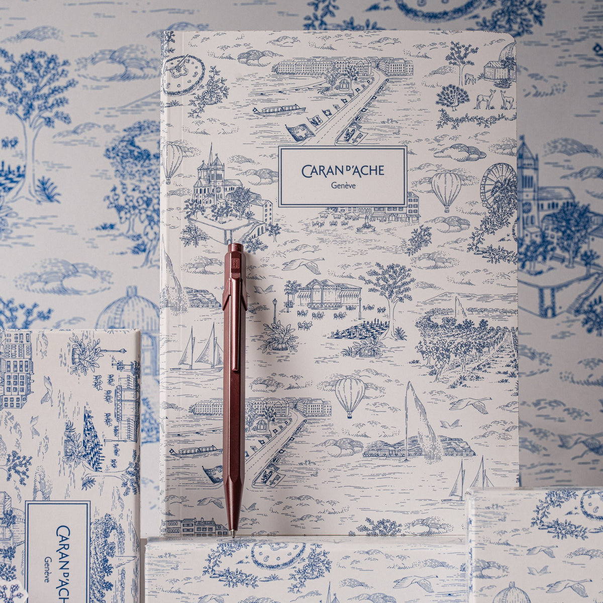 Caran d'Ache Toile de Jouy A5 notebook with burgundy 849 ballpoint pen