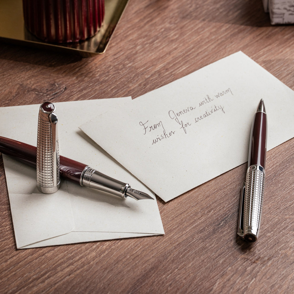 Caran d'Ache Toile de Jouy Léman fountain pen with leather holder on a desk
