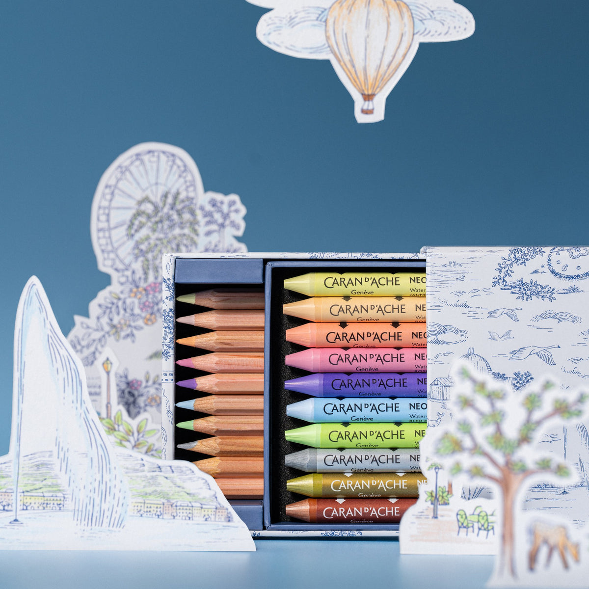Caran d'Ache Toile de Jouy Mixed Media Set open with Geneva paper cut-outs